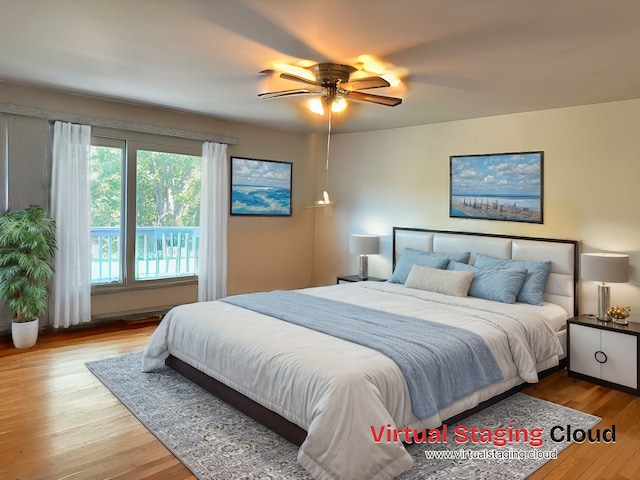 bedroom featuring light hardwood / wood-style flooring and ceiling fan