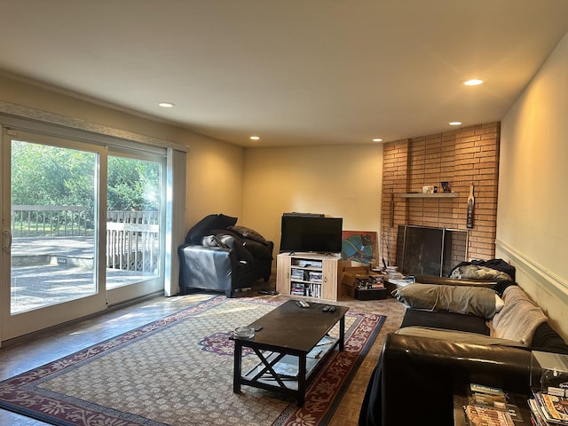 living room with a brick fireplace