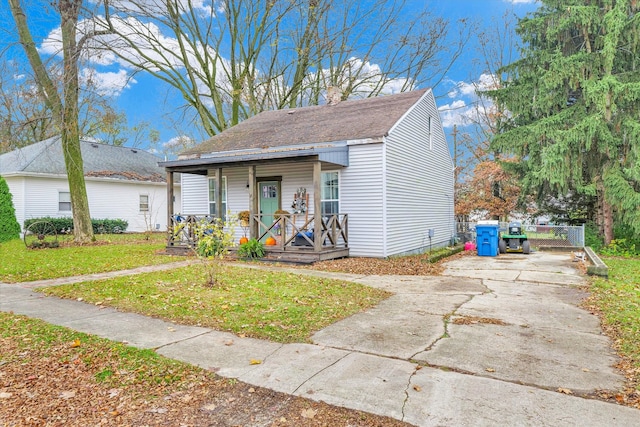 bungalow-style house featuring a front yard and a porch