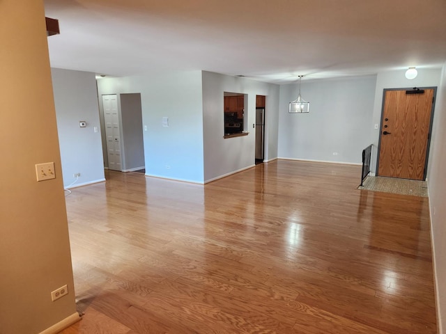 709 79th St Unit 309, Darien, IL 60561 - spare room with light wood finished floors and baseboards