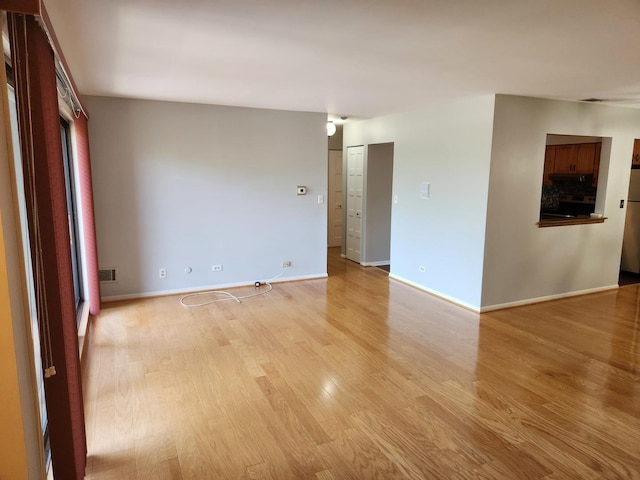 709 79th St Unit 309, Darien, IL 60561 - empty room with light wood-type flooring and baseboards