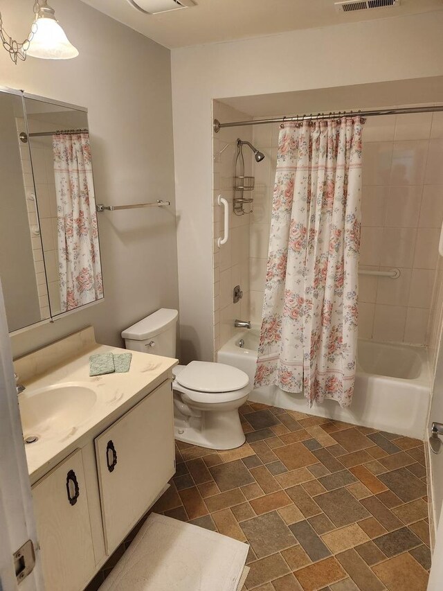 709 79th St Unit 309, Darien, IL 60561 - bathroom with shower / bathtub combination with curtain, vanity, and toilet