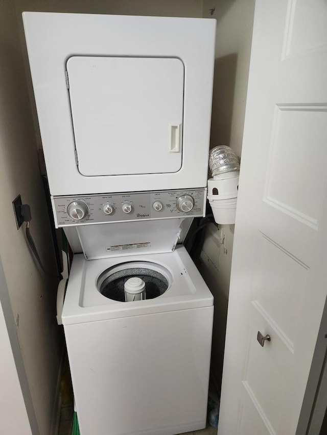 709 79th St Unit 309, Darien, IL 60561 - laundry room featuring stacked washer and clothes dryer