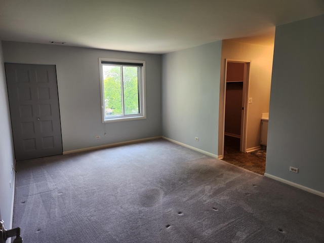 709 79th St Unit 309, Darien, IL 60561 - unfurnished bedroom featuring carpet flooring and baseboards