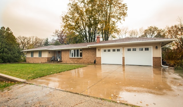 view of front of house with a garage and a front lawn