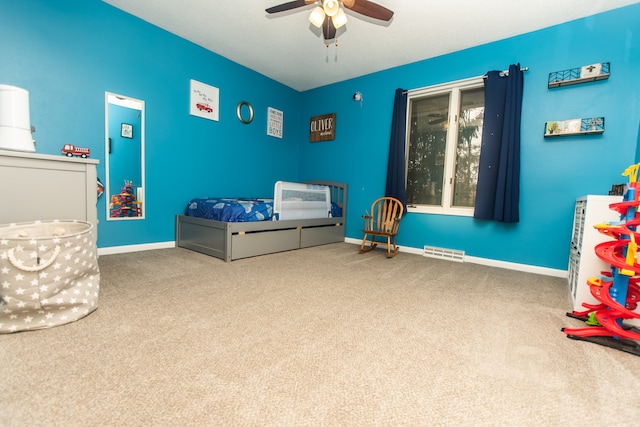 carpeted bedroom featuring ceiling fan