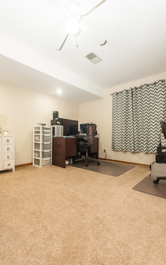 office space featuring light carpet and ceiling fan