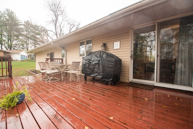 wooden terrace with a grill