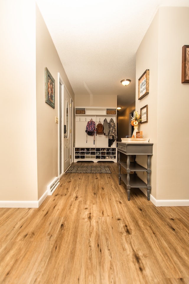 corridor featuring light hardwood / wood-style floors