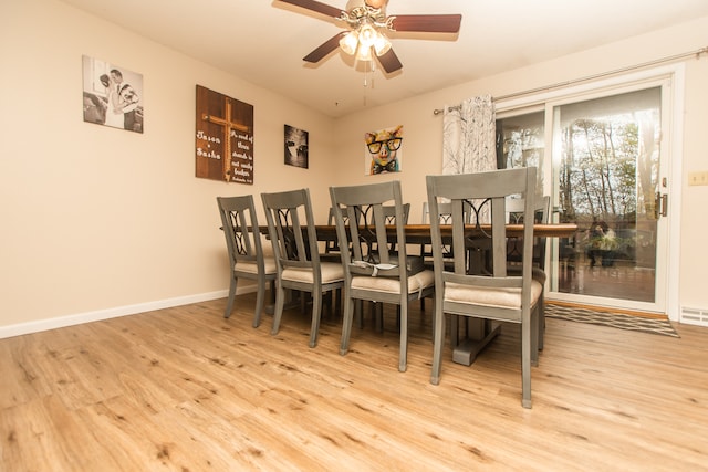 dining space with light wood-type flooring and ceiling fan