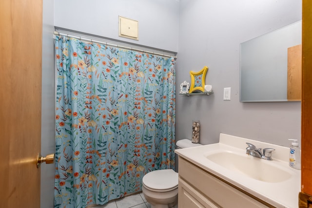 bathroom with vanity, toilet, tile patterned floors, and a shower with curtain