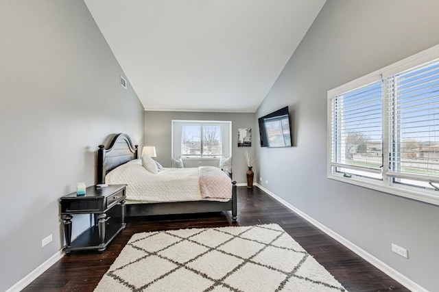 bedroom with dark hardwood / wood-style flooring and vaulted ceiling