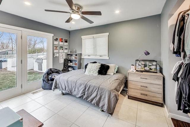 bedroom with ceiling fan, light tile patterned flooring, and access to exterior