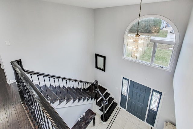 foyer with a healthy amount of sunlight and an inviting chandelier