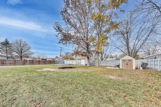 view of yard with a storage unit and a trampoline