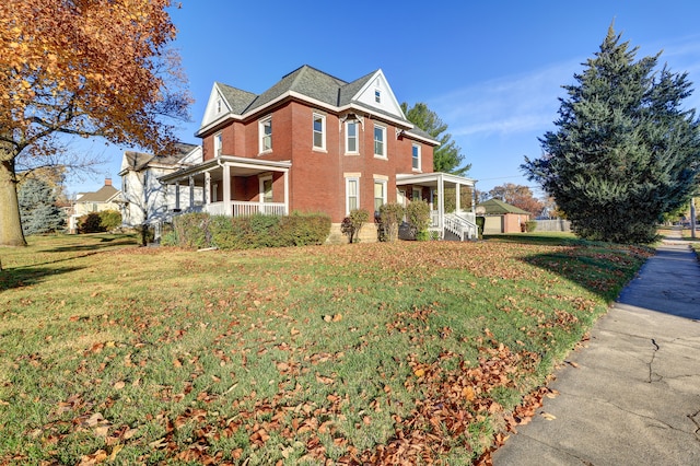 view of property exterior featuring covered porch and a yard