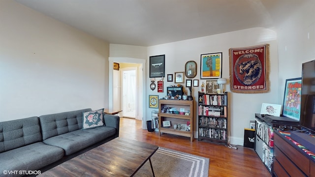 living room with dark hardwood / wood-style flooring