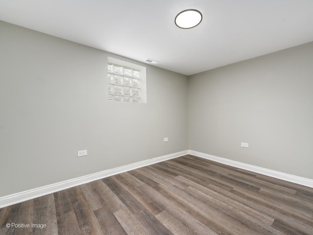 spare room with hardwood / wood-style flooring