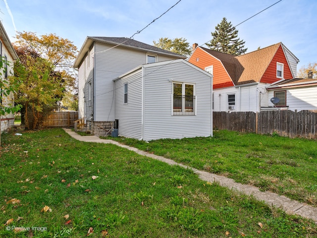 view of side of property with a yard