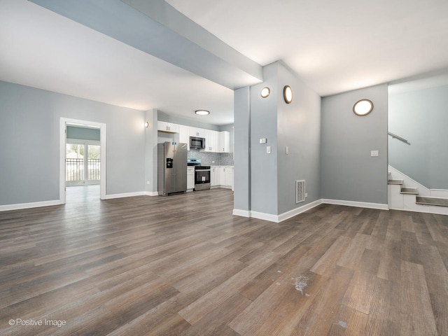 unfurnished living room with hardwood / wood-style flooring