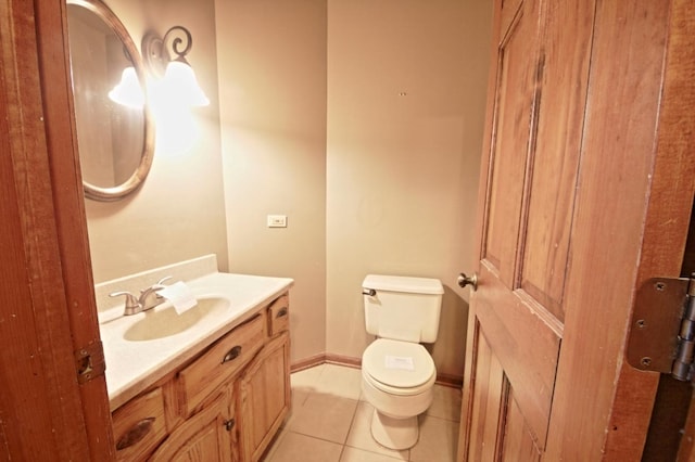 bathroom with tile patterned floors, vanity, and toilet