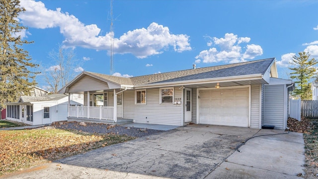 ranch-style home with covered porch and a garage