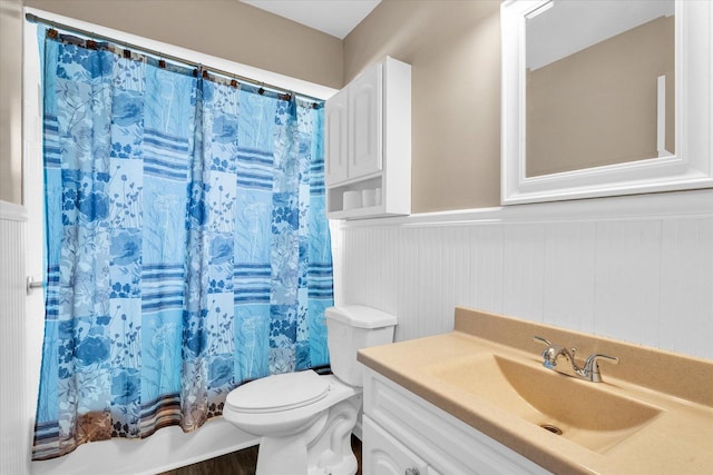 bathroom featuring hardwood / wood-style flooring, vanity, and toilet