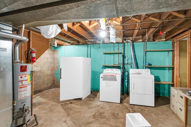 basement with separate washer and dryer and water heater