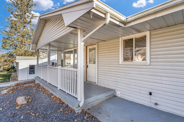 entrance to property featuring a porch