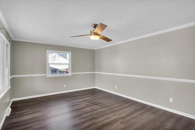 spare room with crown molding, dark hardwood / wood-style flooring, and ceiling fan