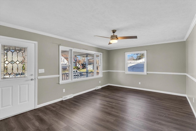 interior space featuring a textured ceiling, plenty of natural light, dark hardwood / wood-style flooring, and crown molding