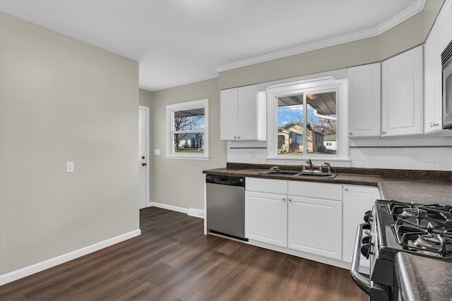 kitchen featuring appliances with stainless steel finishes, dark hardwood / wood-style floors, white cabinetry, and sink