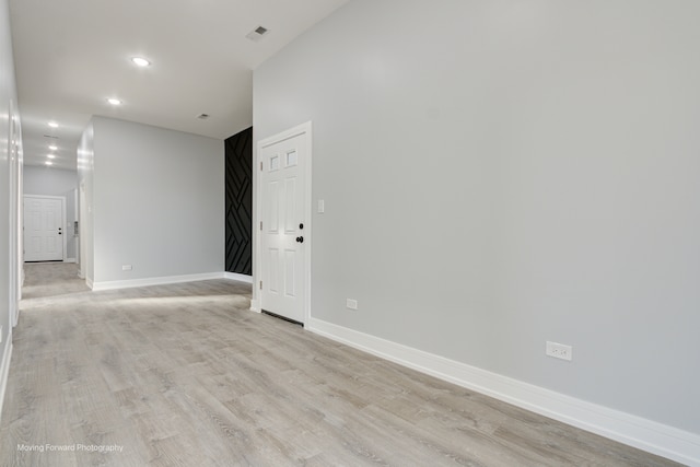 unfurnished room with light hardwood / wood-style flooring