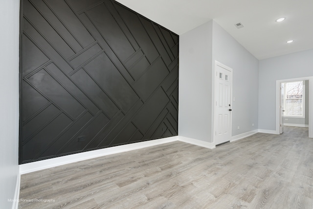 unfurnished room with light wood-type flooring