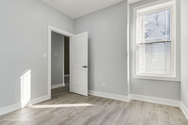 spare room with light hardwood / wood-style floors