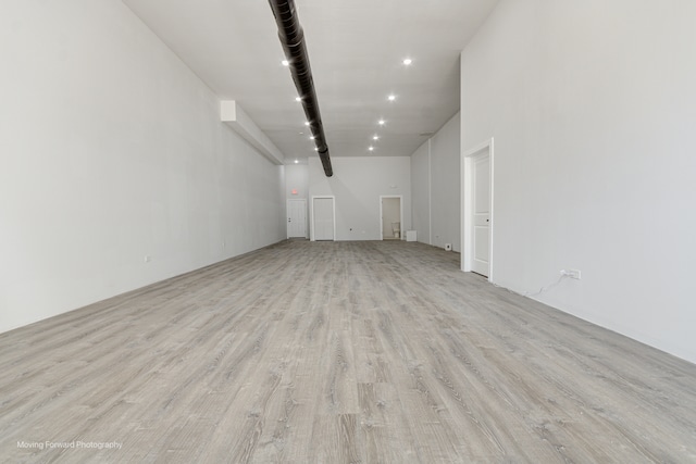 unfurnished living room featuring light wood-type flooring