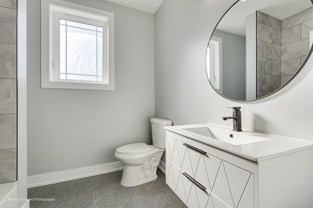 bathroom featuring toilet, vanity, and tile patterned floors