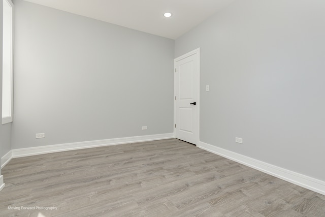 spare room with light hardwood / wood-style floors