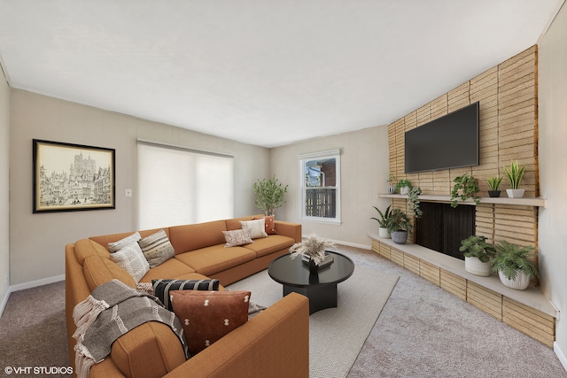 living room featuring a fireplace and carpet floors