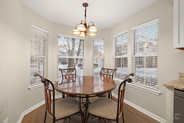 dining space with a notable chandelier and dark wood-type flooring