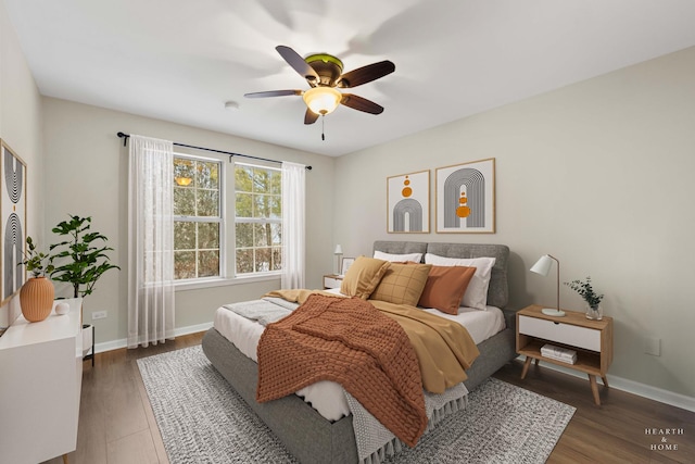 bedroom featuring ceiling fan and dark hardwood / wood-style flooring