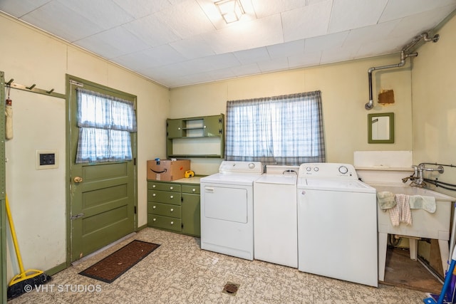 clothes washing area with washing machine and clothes dryer