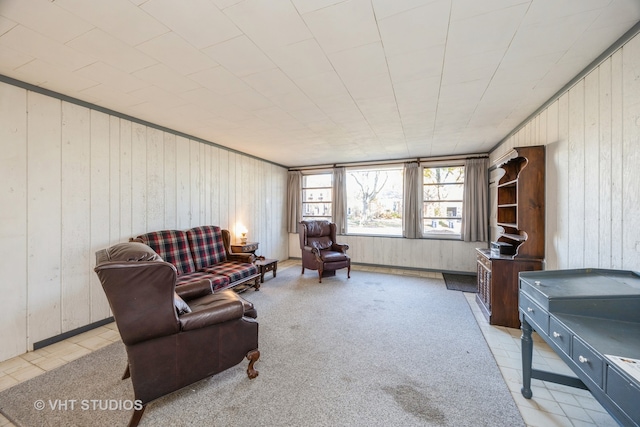 interior space featuring wood walls and light tile patterned floors