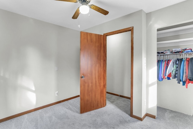 bedroom with a closet, light colored carpet, and ceiling fan