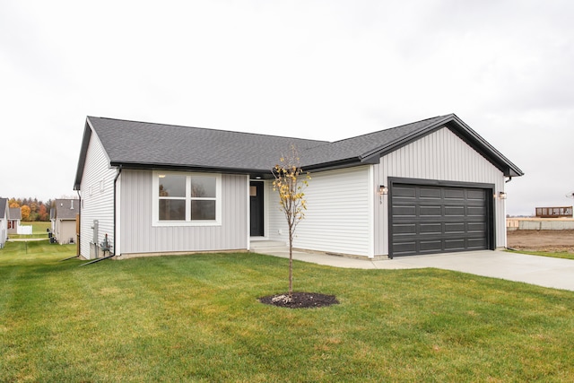 view of front of home with a garage and a front yard