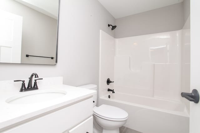 full bathroom featuring tub / shower combination, vanity, and toilet