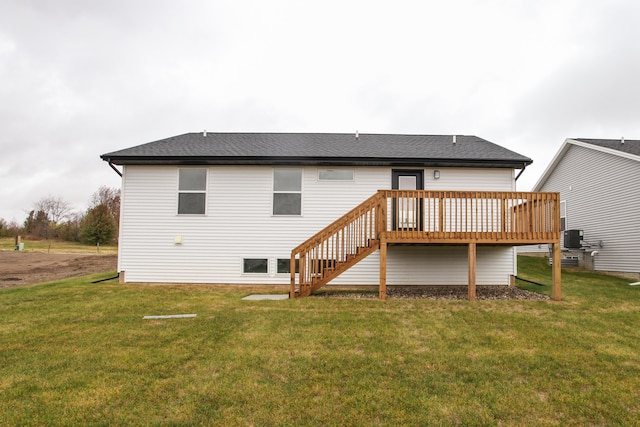 back of property featuring central AC, a yard, and a deck