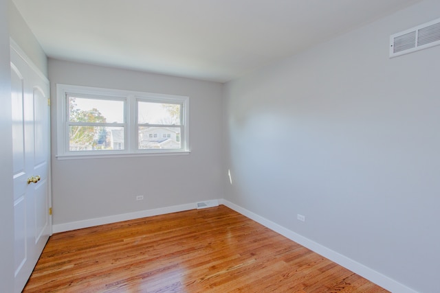 unfurnished room with light hardwood / wood-style flooring