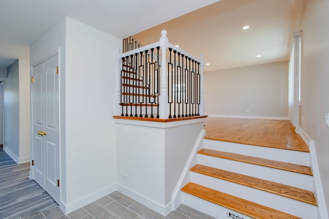 staircase featuring hardwood / wood-style floors