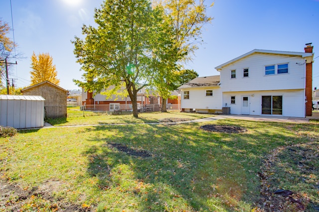 view of yard featuring a patio and a storage unit